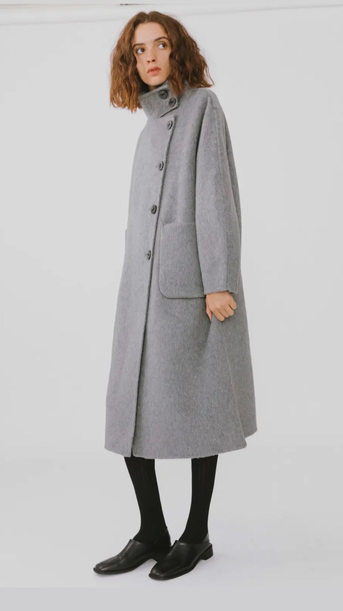 Manteau long asymétrique à col haut